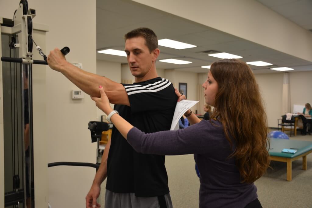 LSTC physical therapist working with patient